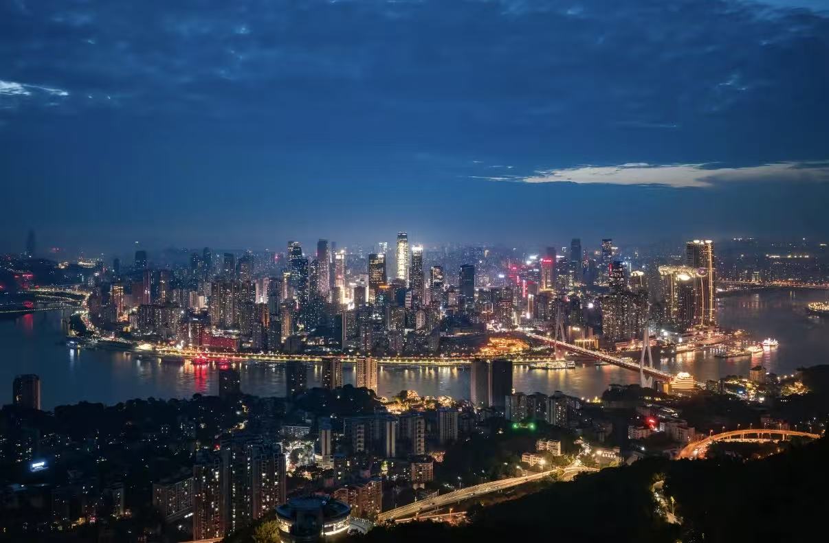 Chongqing's river and skyline illuminated after sunset