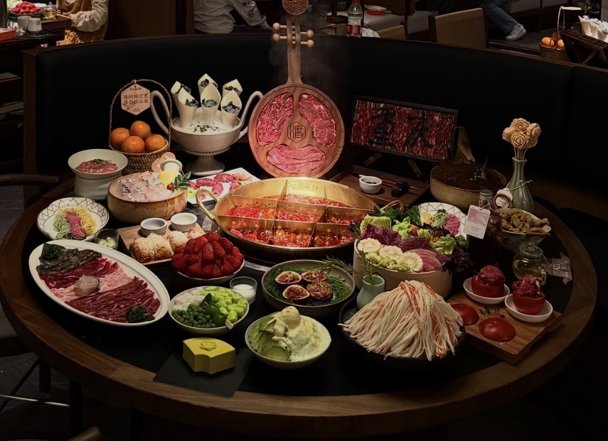 Chongqing hotpot table with spicy broth and local dishes