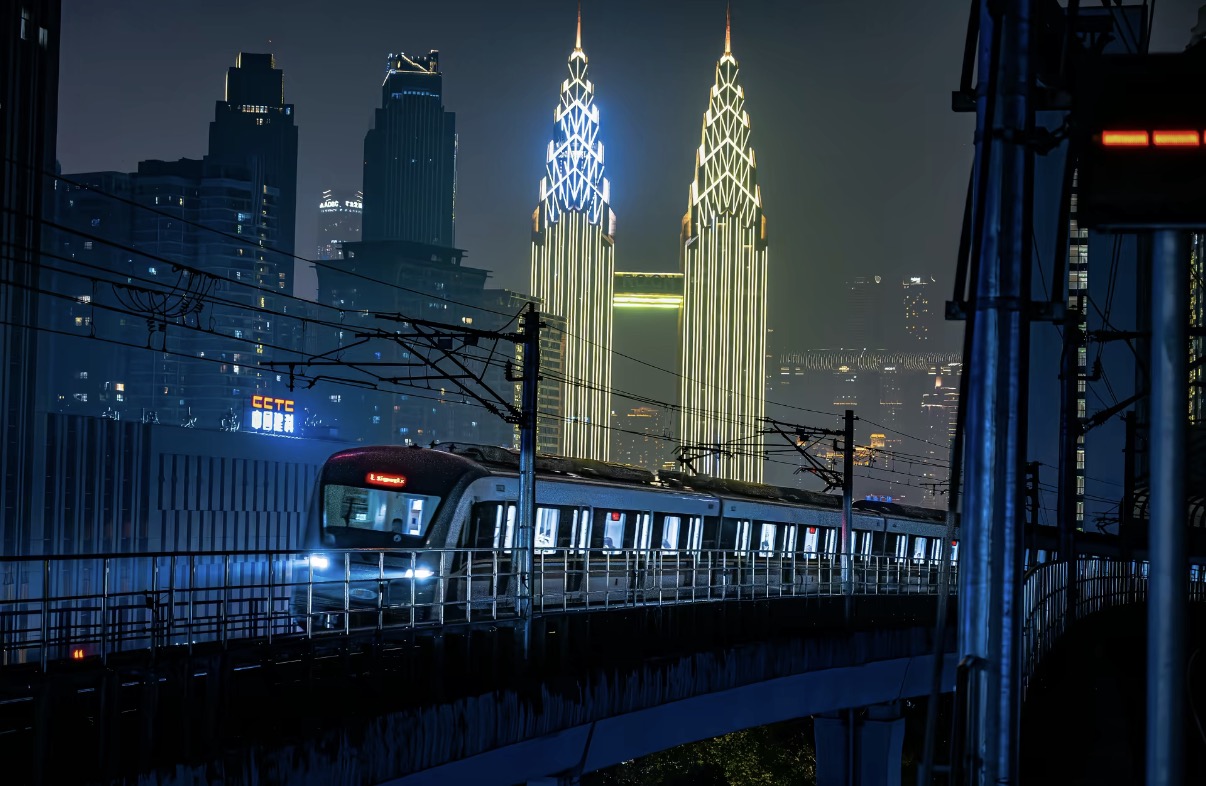 Chongqing metro passing through the city at night
