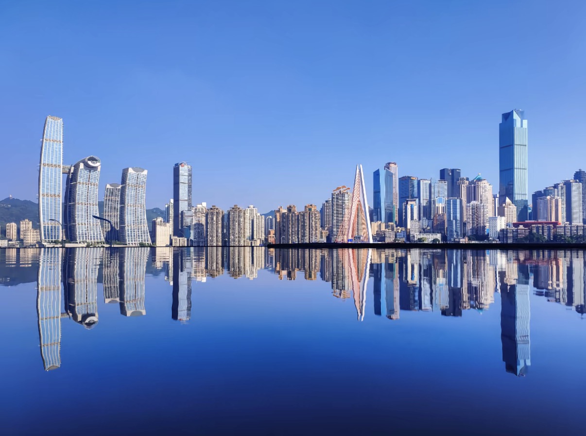 Chongqing skyline reflected across the river in daylight