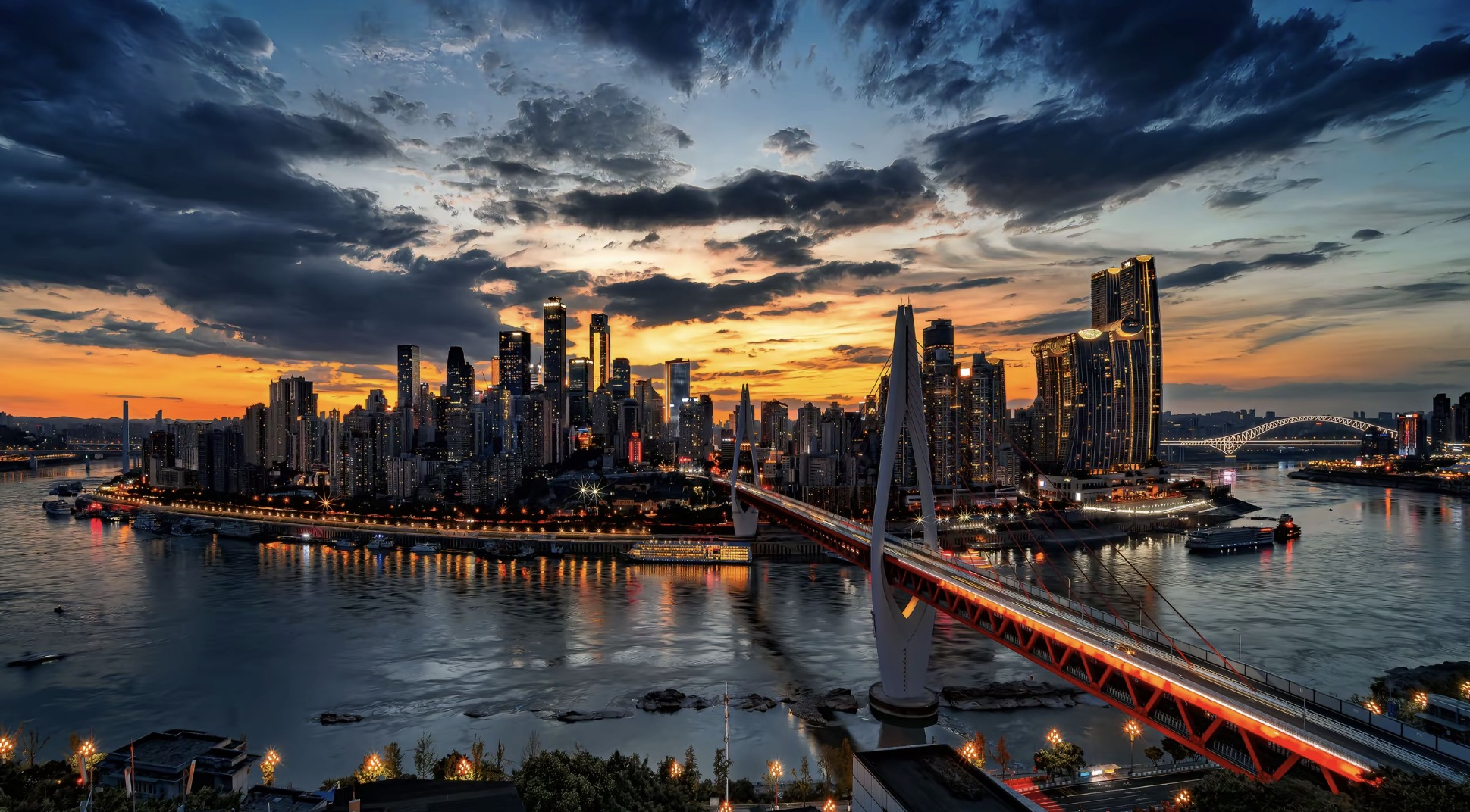 Chongqing skyline and river bridges at sunset